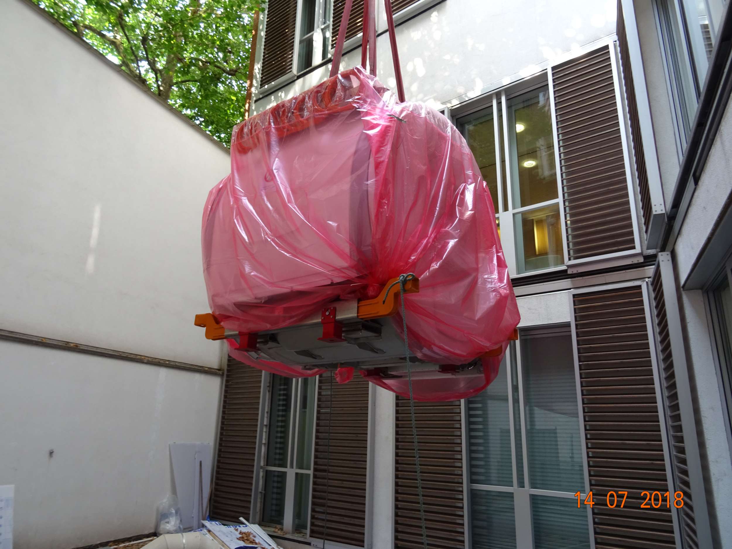 Crane drop - lowering into hospital through roof