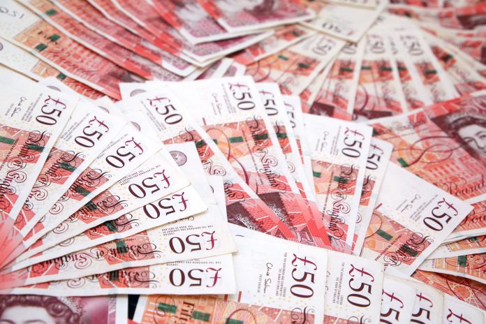 Great Britain £50 - fifty pounds sterling notes spead out.