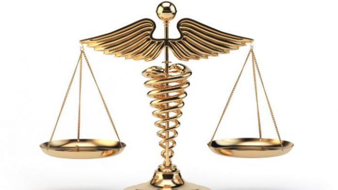 medical-caduceus-symbol-as-scales-concept-of-medicine-and-justice-picture-id816222658