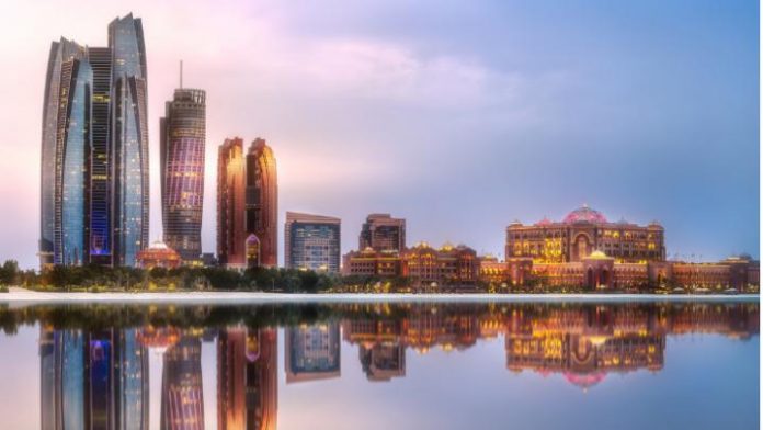 view-of-abu-dhabi-skyline-at-sunrise-uae-picture-id938648918