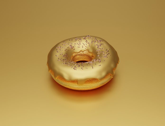Golden donut with golden glaze, sweet unusual doughnut on golden background, jewelry craftsmanship, 3d render
