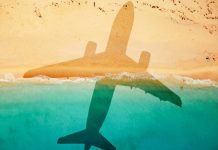 Bupa launches concierge service for high net worth individuals An airplane's shadow casted over a beach