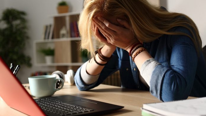 Confused_Sad_Person_Laptop_iStock-1218587964