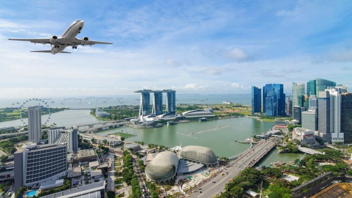 Airplane flying over Singapore