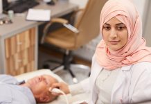 International restrictions for Saudi travellers Young Arab woman performing a ultrasound scan on patient