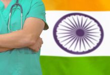 Medical travel optimism for India Doctor in front of Indian flag