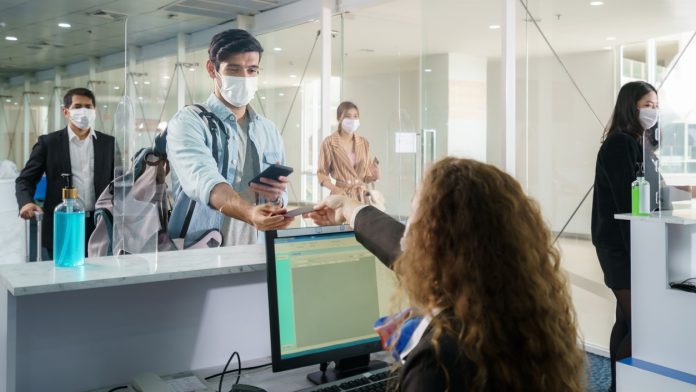 covid-19 travel counter mask_iStock-1290619722