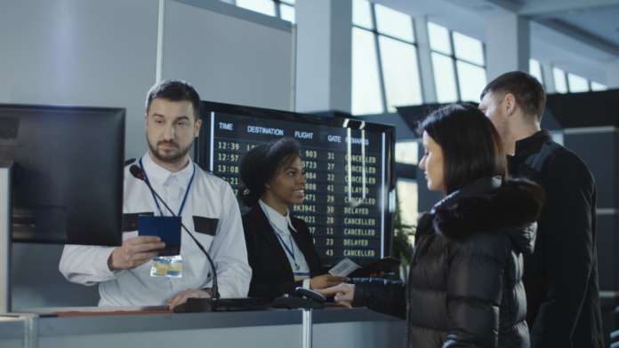 Stock image of airport passport checks, referencing European travel authorisation system