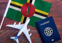Dominica: option for medical tourism A Dominica flag, passport and toy airplane that refers to medical tourism