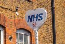 No more UK state-funded medical travel? Sign showing the NHS logo