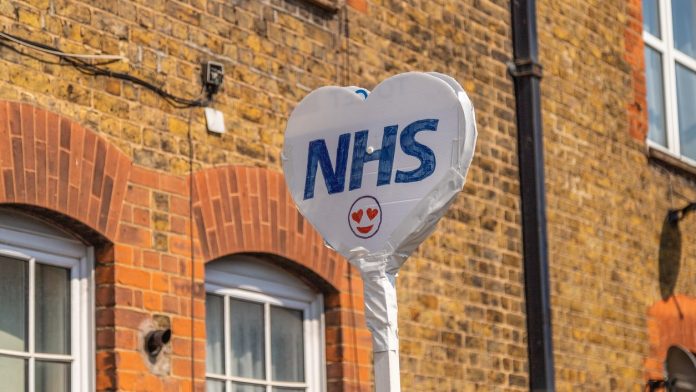 Sign showing the NHS logo