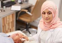 UAE encourages healthcare investment Stock image of UAE nurse treating patient