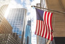 Ageing US population doesn’t mean more medical travel US flag with a skyscraper in the background