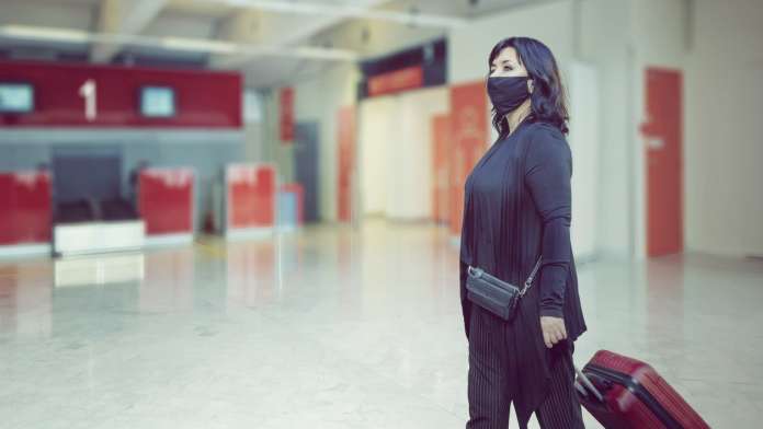 Woman passenger through an airport