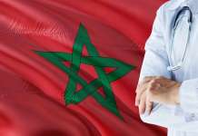 Largest hospital for Morocco Hospital doctor in front of Morocco flag
