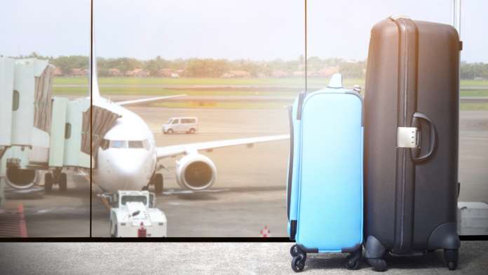 Suitcases at airport_iStock-946562832 Suitcases at an airport, referencing 2022 tourism recovery