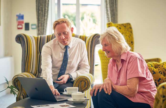 Adlington Retirement Living homeowner Joan with Adam Tomlinson General Manager at The Chimes
