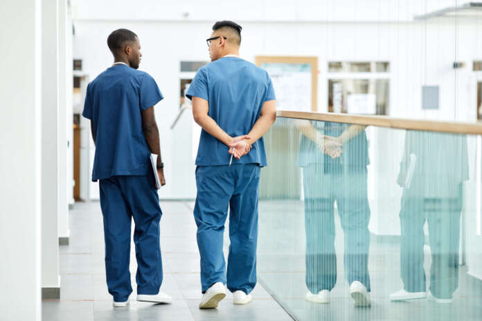 Medics in Clinic Hall Back View