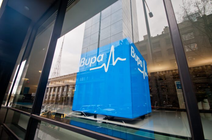 Bupa health insurance company corporate blue logo statue in the building