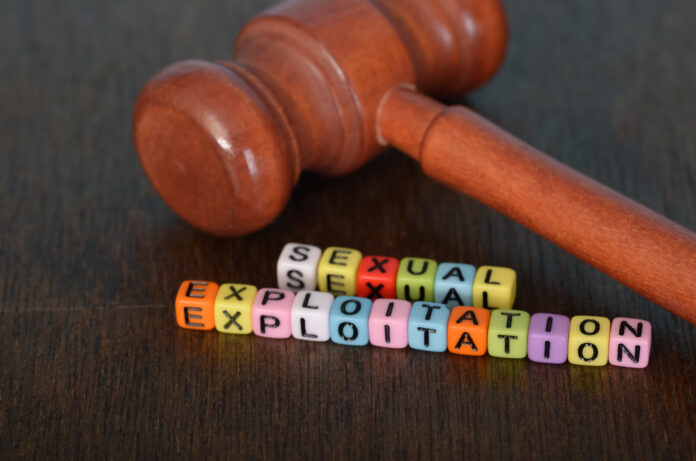 Alphabet Beads Forming 'Sexual Exploitation' with a Judge Gavel - Symbolizing Justice and Awareness Against Exploitation