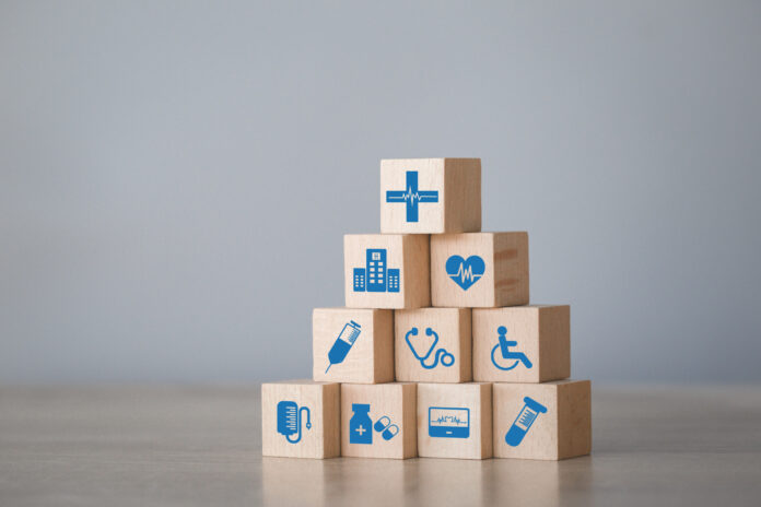 Health Insurance Concept,arranging wood block stacking with icon
