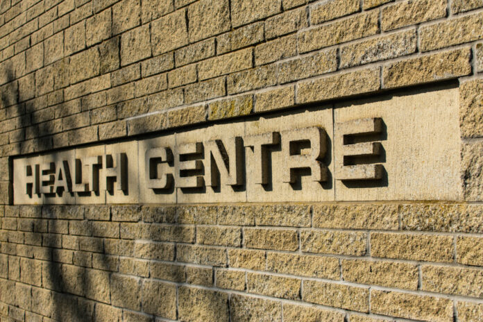 Health Care words in brick on a wall with a retro mid century style, feel and design
